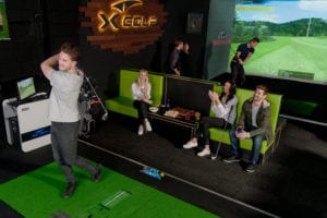 Group of Players enjoying X-Golf Indoor Golf